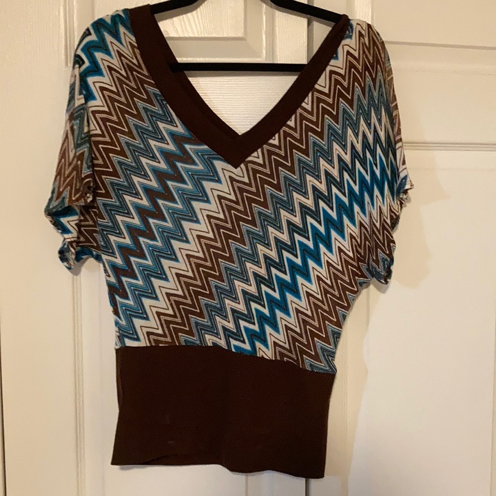 Deep v-neck poncho style fitted blouse